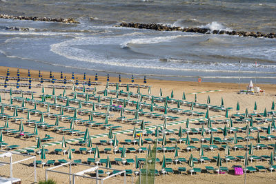 High angle view of chairs on beach