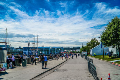 People on street against sky