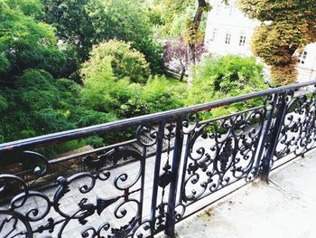 Metal railing by staircase in park