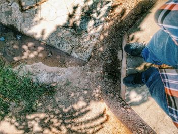 Low section of people standing on tiled floor