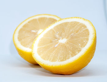 Close-up of orange slice against white background