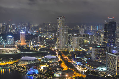 High angle view of illuminated city buildings at night