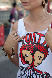 Midsection of woman wearing tank top