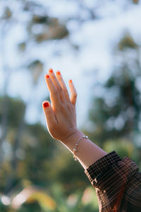 Close-up of woman hand with beautiful background 
