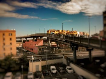 Bridge in city against sky