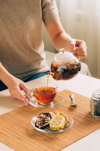 Midsection of woman having food