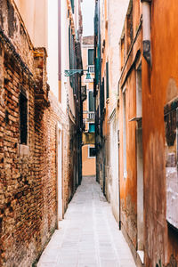 Narrow alley amidst buildings in city