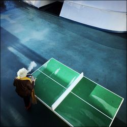 High angle view of woman standing on street