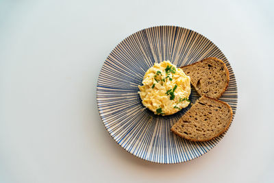 Directly above shot of food in plate on white background