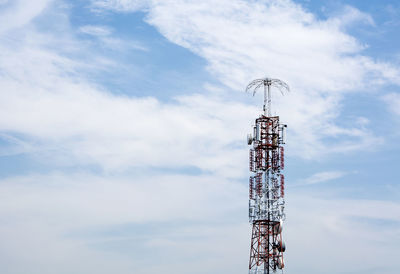 Low angle view of communications tower against sky