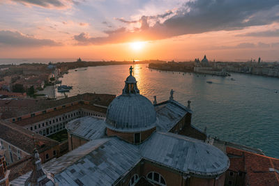 Panoramic view of buildings against sky during sunset