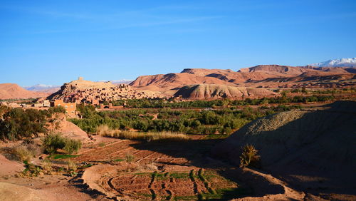 Scenic view of mountain against blue sky