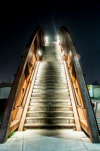 Low angle view of illuminated steps at night