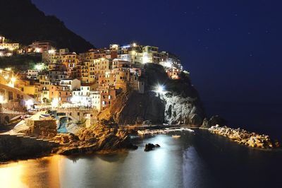 Reflection of illuminated buildings in water