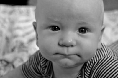 Close-up portrait of cute baby at home