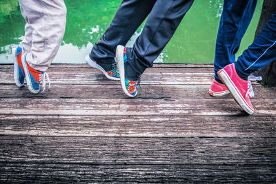 Low section of boys on pier