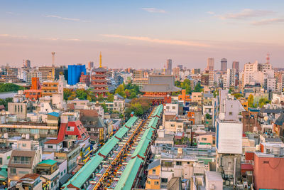 High angle view of buildings in city against sky during sunset