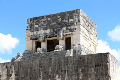 Low angle view of old ruin building against sky