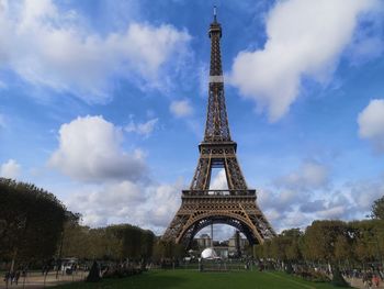 Low angle view of tower against cloudy sky