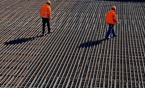 High angle view of workers walking on construction sites 