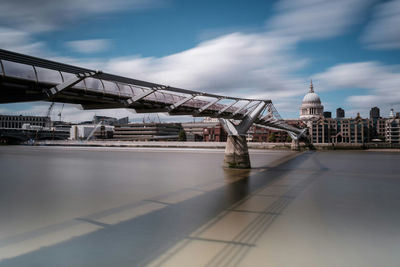 View of bridge against cloudy sky