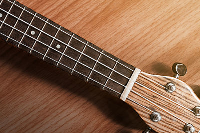 High angle view of guitar on table
