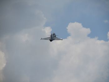 Low angle view of airplane flying in sky