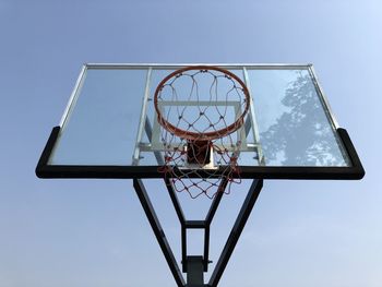 Low angle view of basketball hoop against  blue sky 