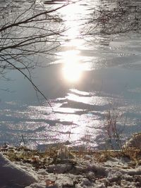 Scenic view of frozen lake against sky during winter