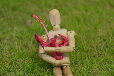 Girl holding toy on field