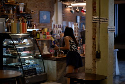 Woman standing in cafe