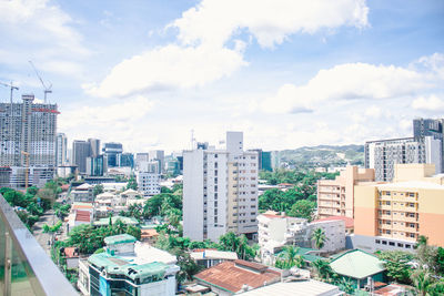 High angle view of buildings in city against sky