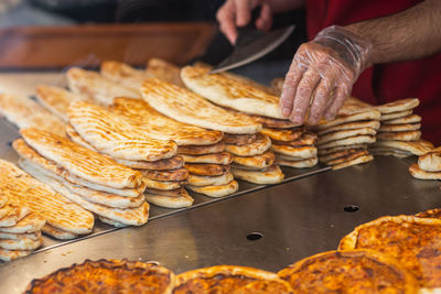 Cropped hand of man preparing food