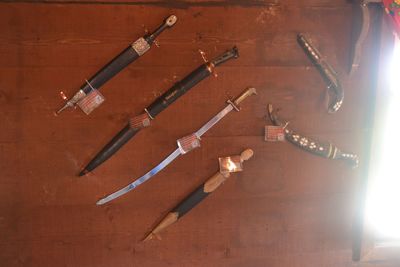 High angle view of objects on wood against wall