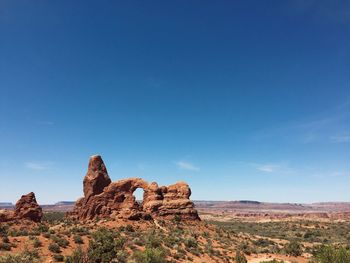 Scenic view of rock formation against sky