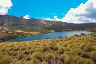 Scenic view of lake alice against mountains in mount kenya national park, kenya