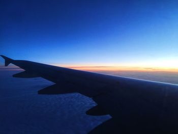 Cropped image of airplane wing