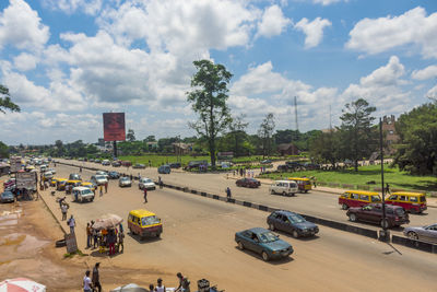 High angle view of vehicles on road against sky