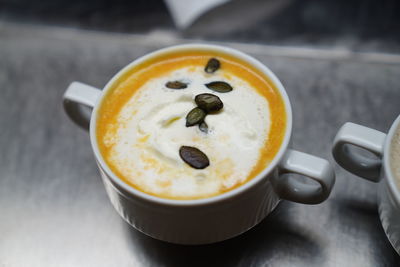 Close-up of cappuccino on table