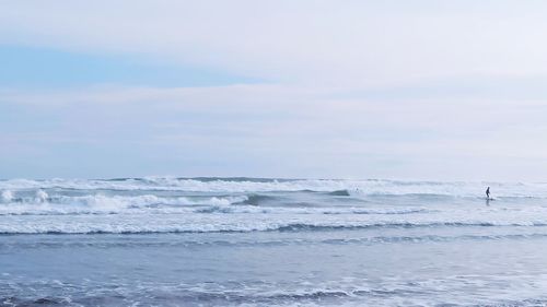 Surfing in parangtritis beach yogyakarta, indonesia