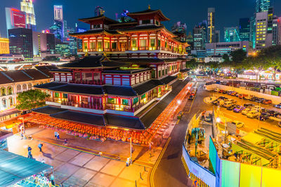 High angle view of illuminated buildings at night