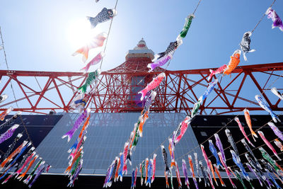 Low angle view of tokyo tower against blue sky