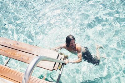 High angle view of man swimming in pool