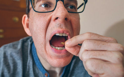 Close-up of man eating food