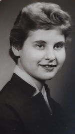 Close-up portrait of smiling young woman