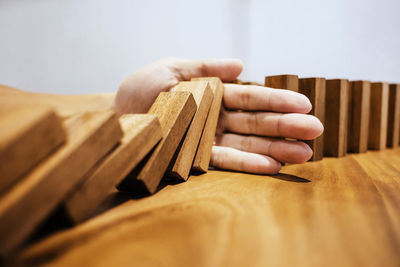 Close-up of man hand on table