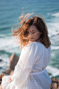 Woman sitting at beach