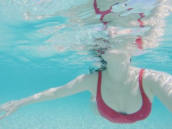 Woman swimming in pool