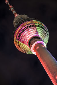 Low angle view of fernsehturm against sky at night