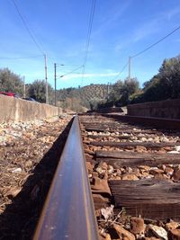 Electricity pylons on railroad track